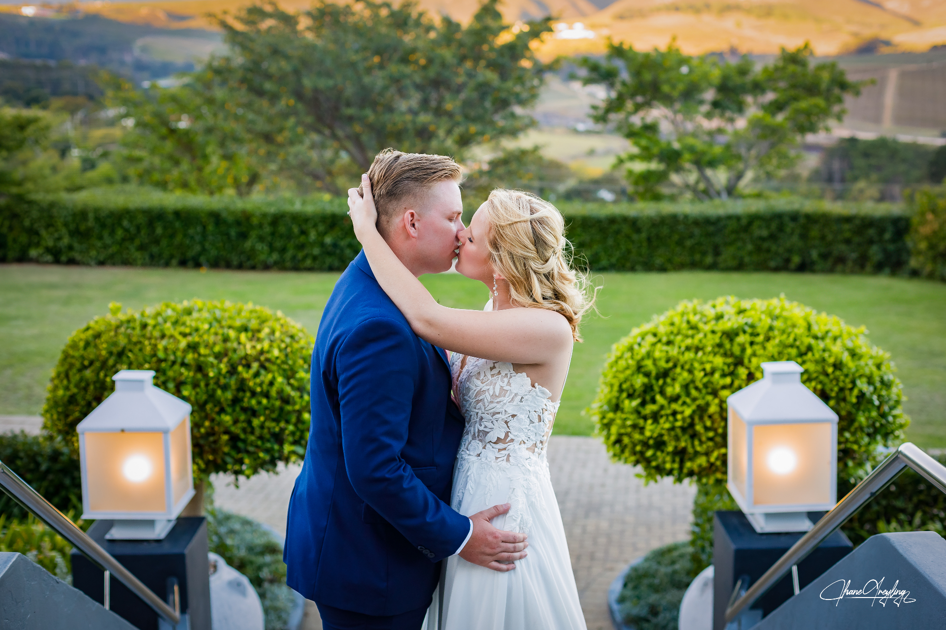 Couple kissing at garden venue