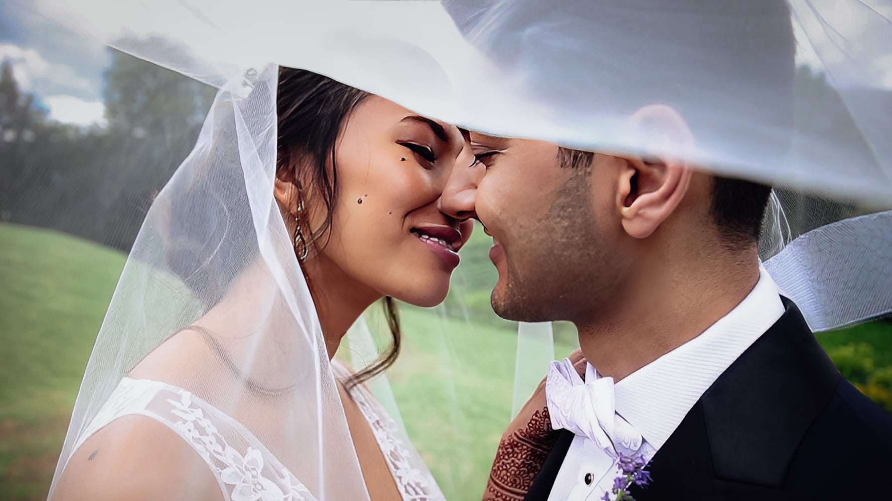 Bride and groom smiling, feeling comfortable on camera on your wedding day.